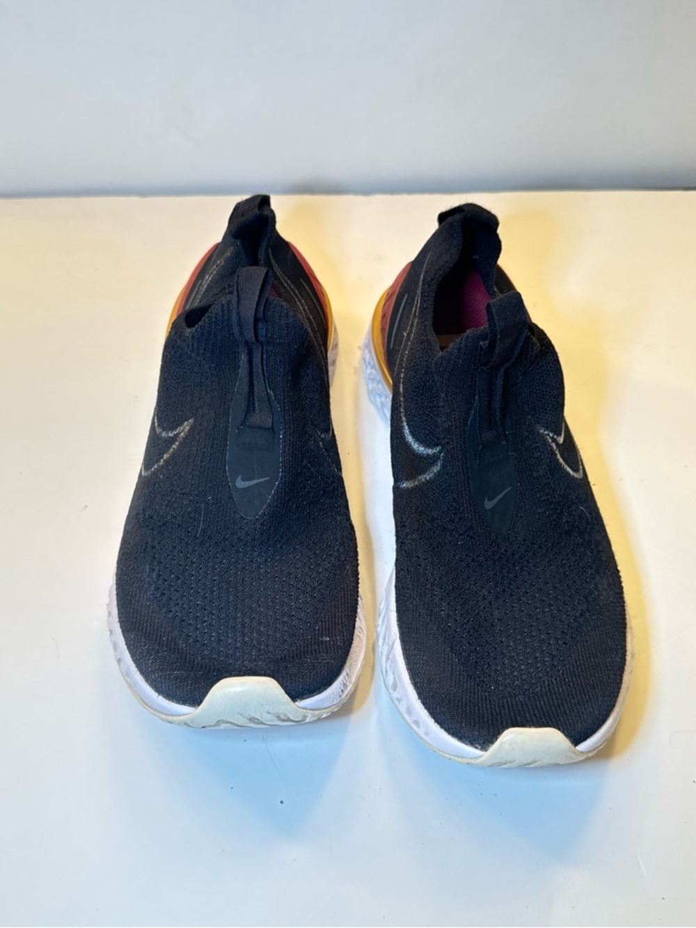 Nike Black Slip-On Athletic Shoes with Orange Heel Accent